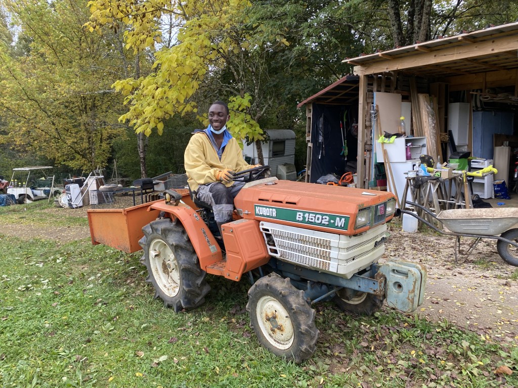 Man on our farm tractor