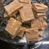 Plate of home made ginger fudge, lemon meringue fudge and salted caramel fudge