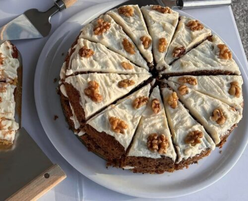 Carrot cake with cream cheese and walnut topping